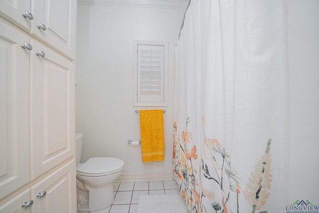 bathroom featuring tile patterned floors, toilet, and ornamental molding