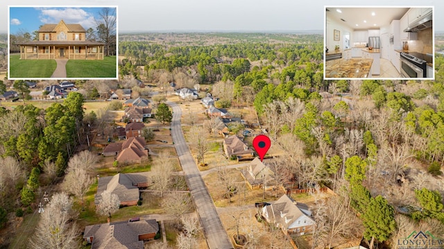 aerial view with a wooded view