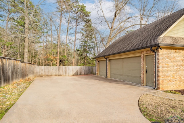 garage with fence