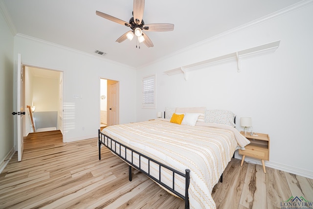 bedroom featuring a ceiling fan, baseboards, visible vents, light wood-style flooring, and ornamental molding