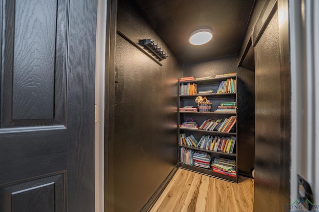 interior details with wood finished floors and a textured wall