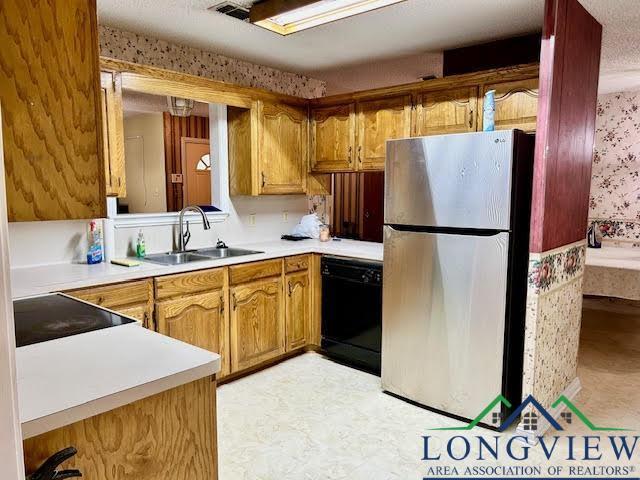 kitchen featuring sink and black appliances