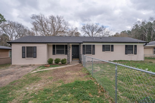 ranch-style house with a front lawn