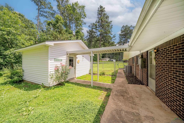 201 Bronco Ln, Linden, TX 75563 - view of yard featuring a gate and an outbuilding