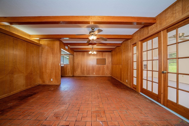 201 Bronco Ln, Linden, TX 75563 - spare room featuring brick flooring, wood walls, beam ceiling, and a ceiling fan