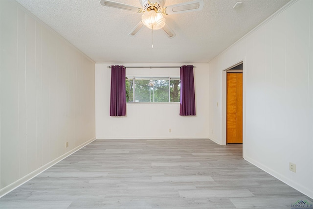 201 Bronco Ln, Linden, TX 75563 - spare room with a ceiling fan, wood finished floors, a textured ceiling, and crown molding