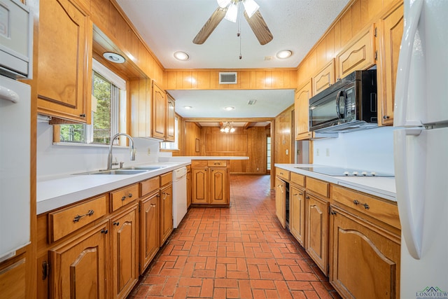 201 Bronco Ln, Linden, TX 75563 - kitchen with black appliances, brick flooring, light countertops, a peninsula, and recessed lighting