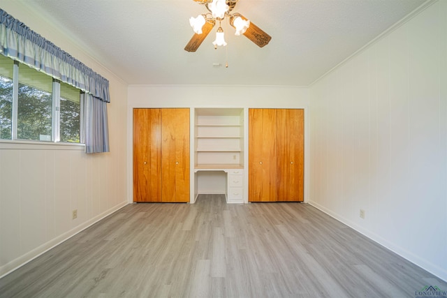 201 Bronco Ln, Linden, TX 75563 - unfurnished bedroom featuring wood finished floors, crown molding, and a ceiling fan
