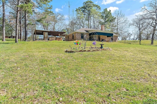 2574 County Road 3412, Chandler, TX 75758 - view of green lawn with a carport