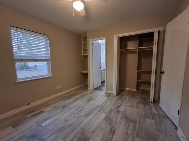 unfurnished bedroom featuring a closet, ensuite bath, and ceiling fan