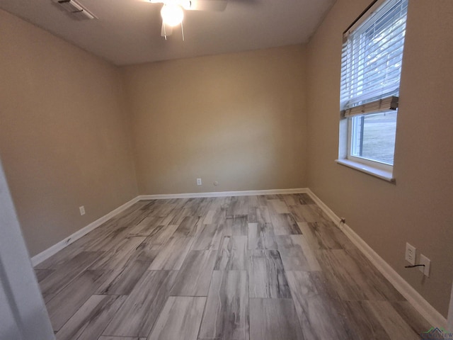 spare room with ceiling fan and light hardwood / wood-style flooring