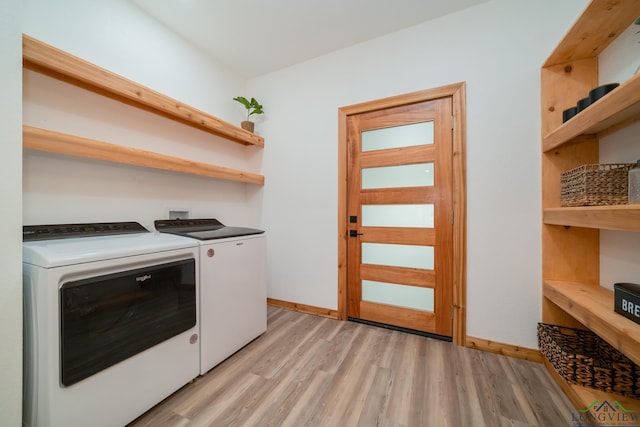 washroom with independent washer and dryer and light hardwood / wood-style flooring