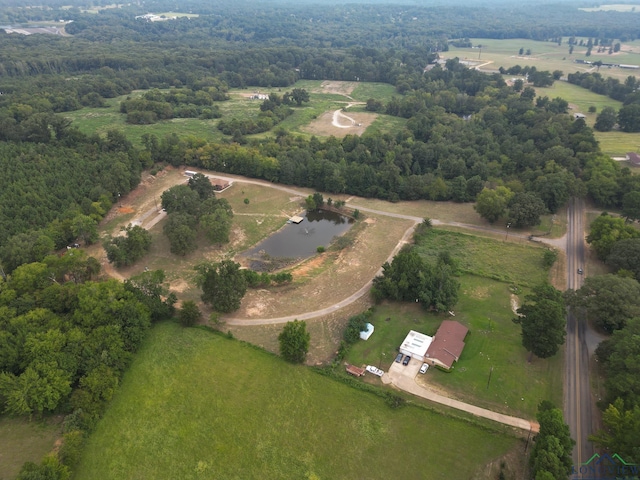 birds eye view of property with a rural view