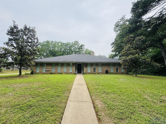 505 Timberdale, Kilgore, TX 75662 - view of front facade featuring a front lawn and brick siding