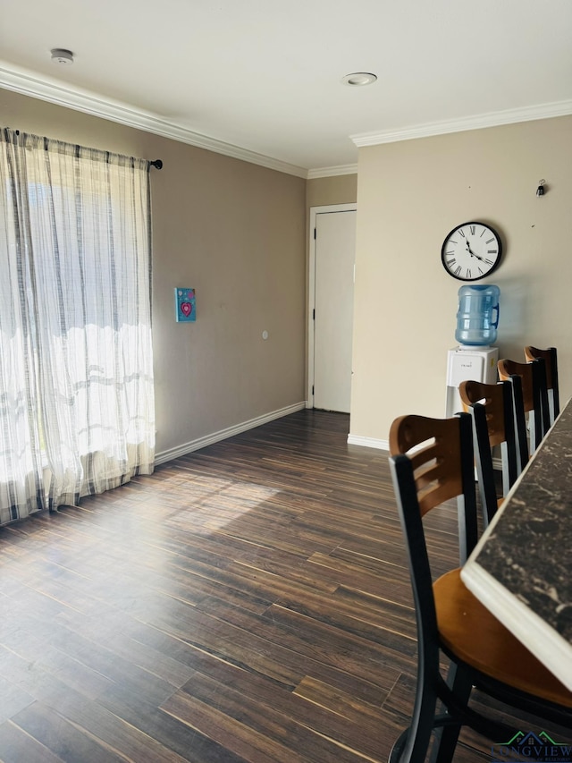 505 Timberdale, Kilgore, TX 75662 - dining area with crown molding, baseboards, and dark wood finished floors