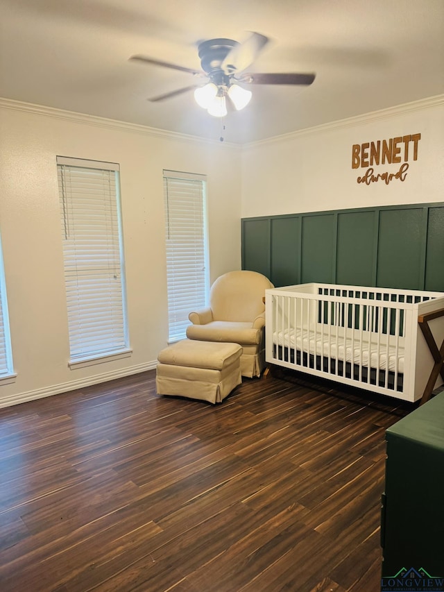 505 Timberdale, Kilgore, TX 75662 - bedroom featuring ornamental molding, a nursery area, wood finished floors, and a ceiling fan