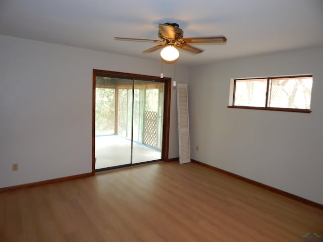 2231 W Stae Highway 154, Gilmer, TX 75644 - unfurnished room with ceiling fan, light wood-style floors, and baseboards