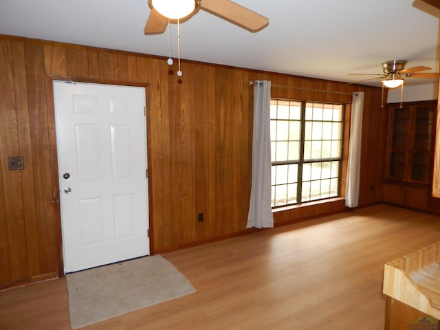 2231 W Stae Highway 154, Gilmer, TX 75644 - foyer with wooden walls, a ceiling fan, and wood finished floors