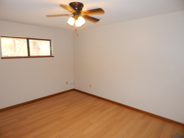 2231 W Stae Highway 154, Gilmer, TX 75644 - unfurnished room with ceiling fan, light wood-style flooring, and baseboards