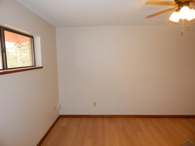 2231 W Stae Highway 154, Gilmer, TX 75644 - empty room featuring light wood-style floors, ceiling fan, and baseboards