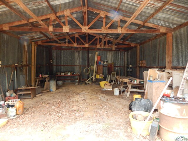 2231 W Stae Highway 154, Gilmer, TX 75644 - miscellaneous room with a garage, vaulted ceiling, and metal wall