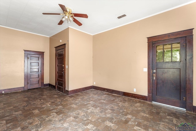 entrance foyer with ornamental molding and ceiling fan