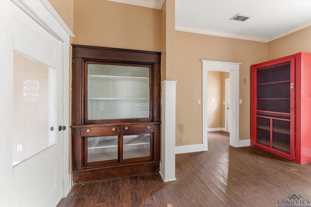 interior space featuring dark hardwood / wood-style flooring and ornamental molding