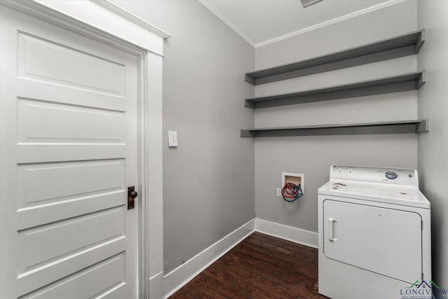 laundry room with crown molding, washer / dryer, and dark wood-type flooring