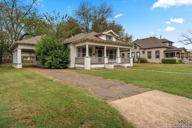 view of front of property with a front yard and a porch