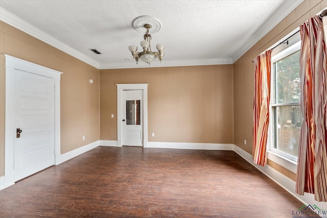 unfurnished room with dark hardwood / wood-style flooring, a textured ceiling, and a notable chandelier