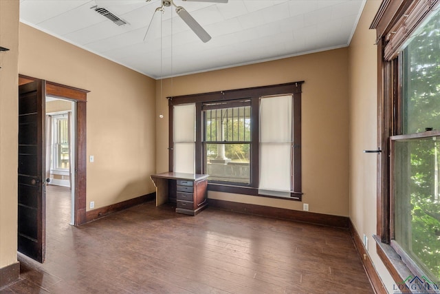 spare room featuring ornamental molding, dark hardwood / wood-style floors, and ceiling fan