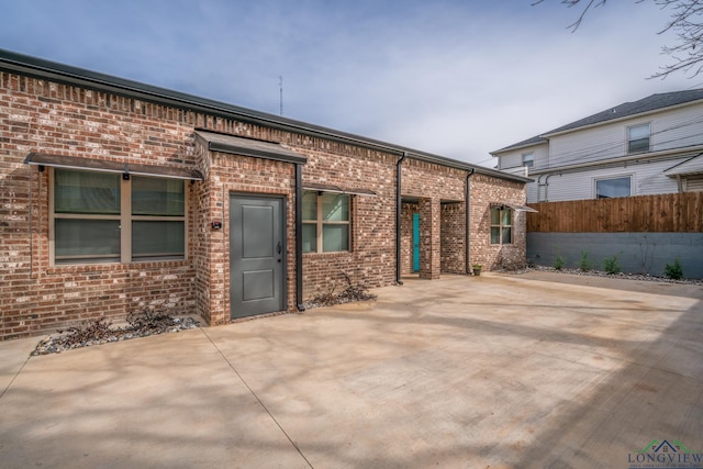 rear view of house featuring a patio area