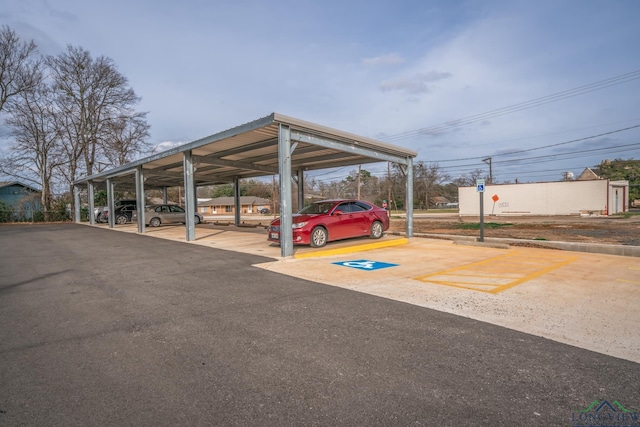 view of parking / parking lot with a carport