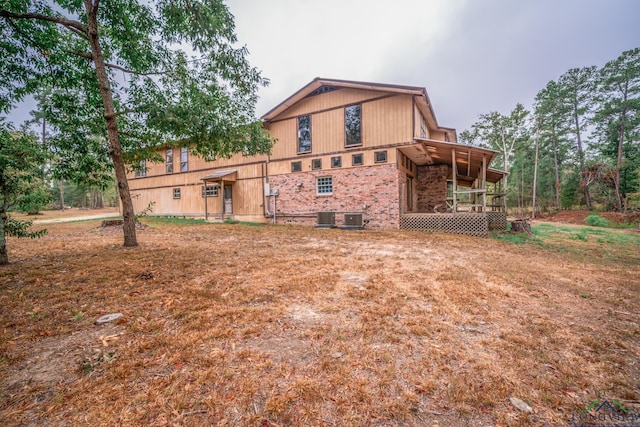 6247 Peters Chapel Rd, Karnack, TX 75661 - rear view of house with central air condition unit