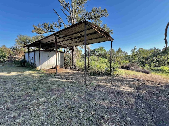 view of vehicle parking with a carport