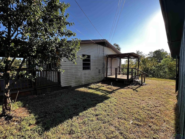 view of yard with a deck