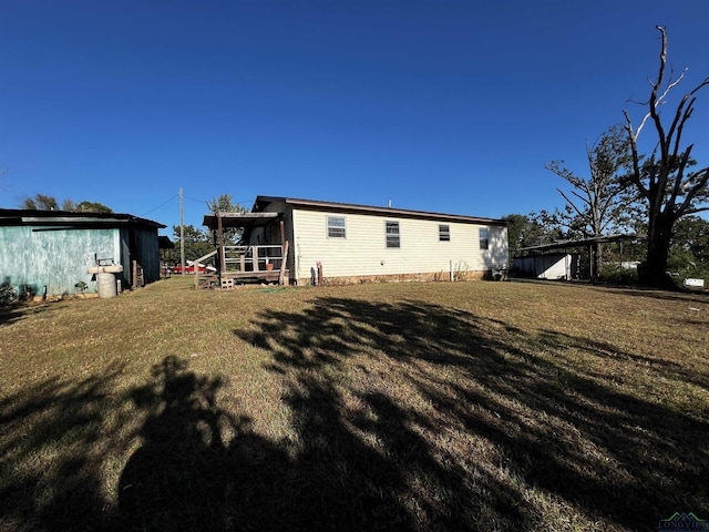 back of property with a lawn