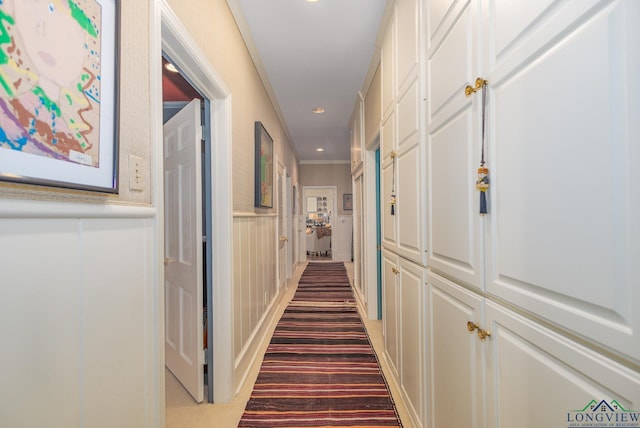 2003 Broadway Blvd, Kilgore, TX 75662 - hall with a decorative wall, recessed lighting, a wainscoted wall, and crown molding