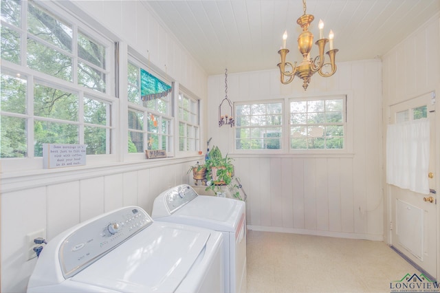 2003 Broadway Blvd, Kilgore, TX 75662 - laundry room featuring a chandelier, separate washer and dryer, a decorative wall, and light floors