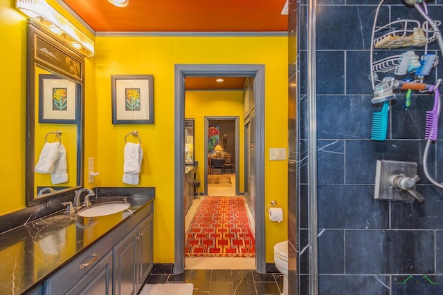 2003 Broadway Blvd, Kilgore, TX 75662 - bathroom with vanity, tiled shower, and crown molding