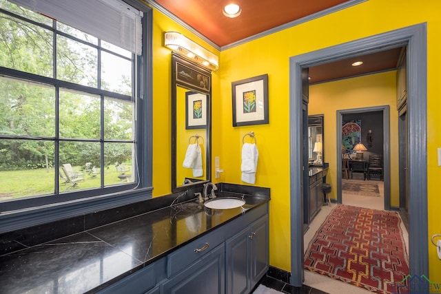 2003 Broadway Blvd, Kilgore, TX 75662 - bathroom featuring crown molding, vanity, and recessed lighting