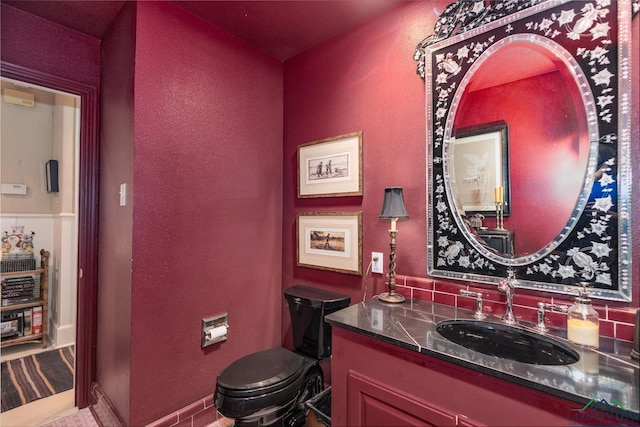 2003 Broadway Blvd, Kilgore, TX 75662 - bathroom with vanity and a textured wall