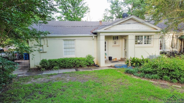 2003 Broadway Blvd, Kilgore, TX 75662 - view of front of house with brick siding and roof with shingles