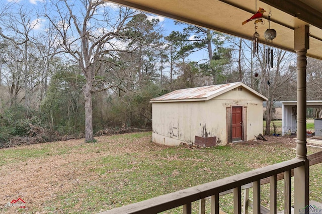 view of yard with an outbuilding and a storage unit