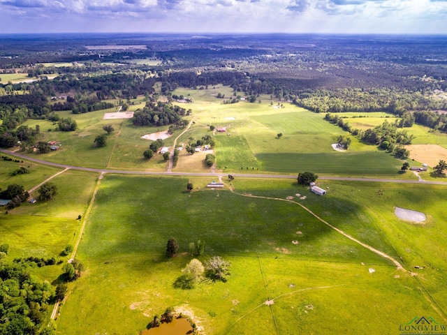 birds eye view of property with a rural view