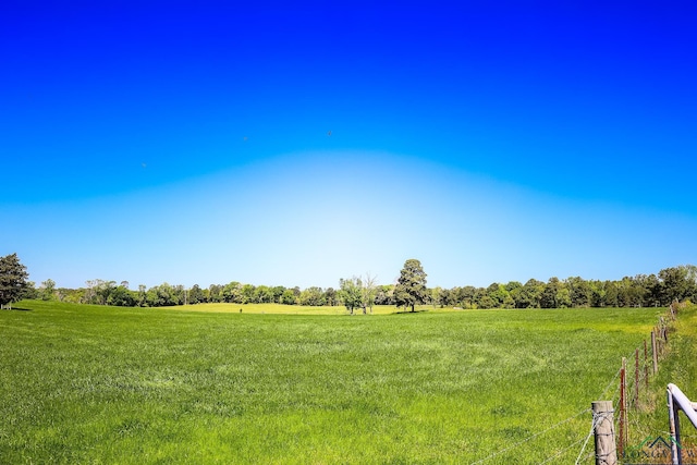 view of yard with a rural view