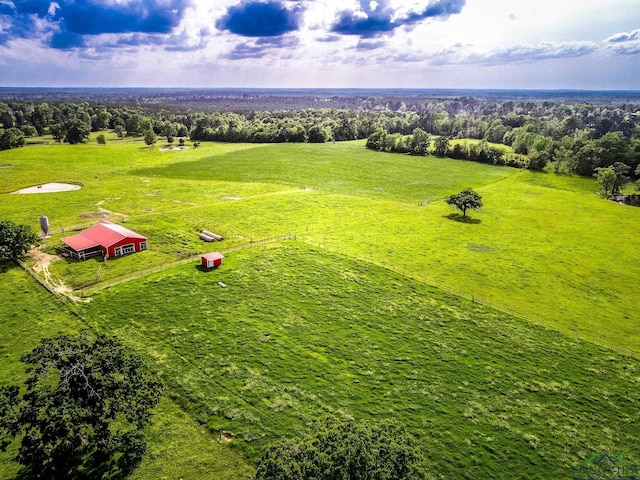 birds eye view of property with a rural view