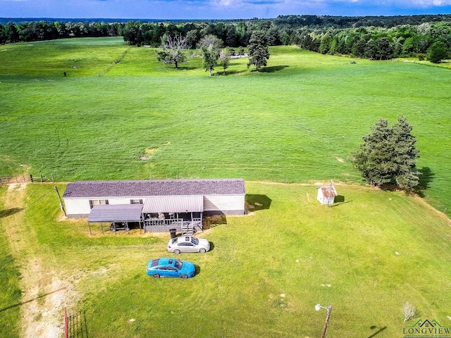 birds eye view of property featuring a rural view