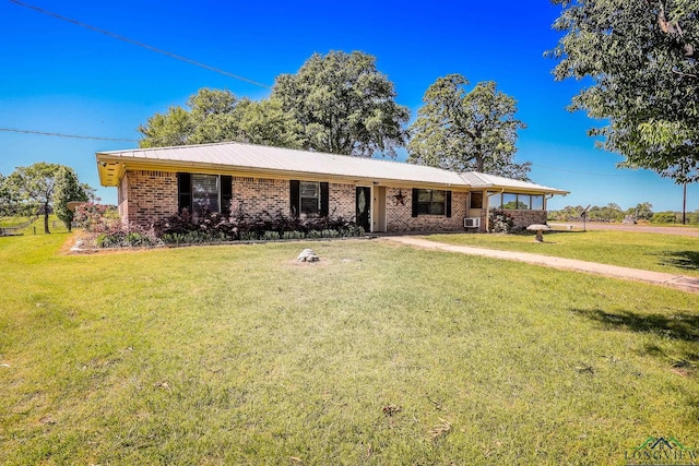 ranch-style house featuring a front lawn