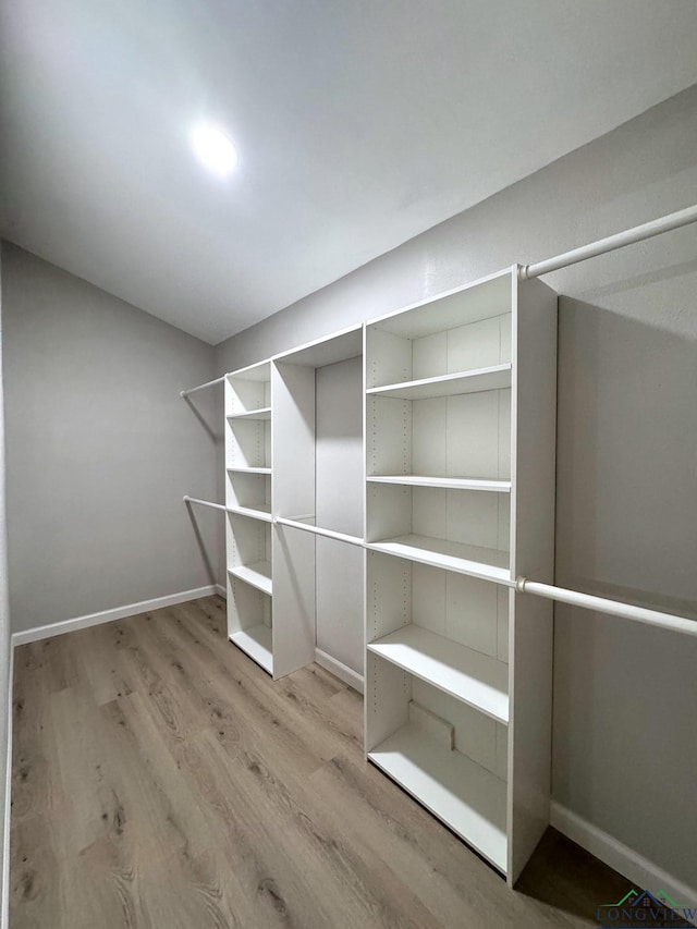 walk in closet featuring light wood-type flooring